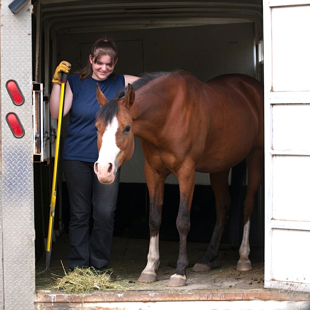 Bridgette and Angel in a horse trailer