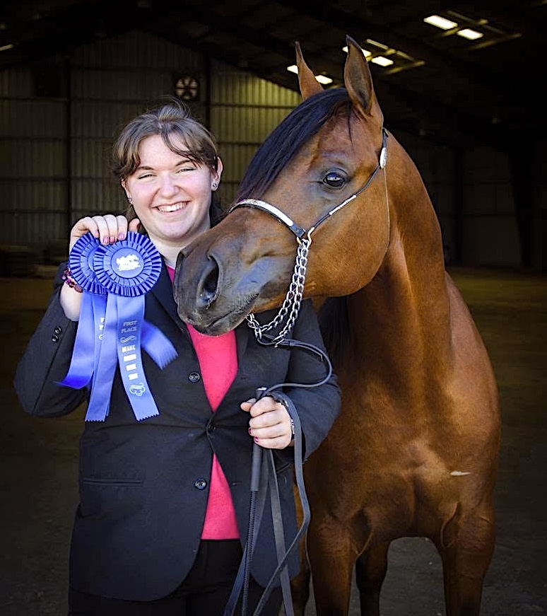 Bridgette and Eddie with a blue ribbon