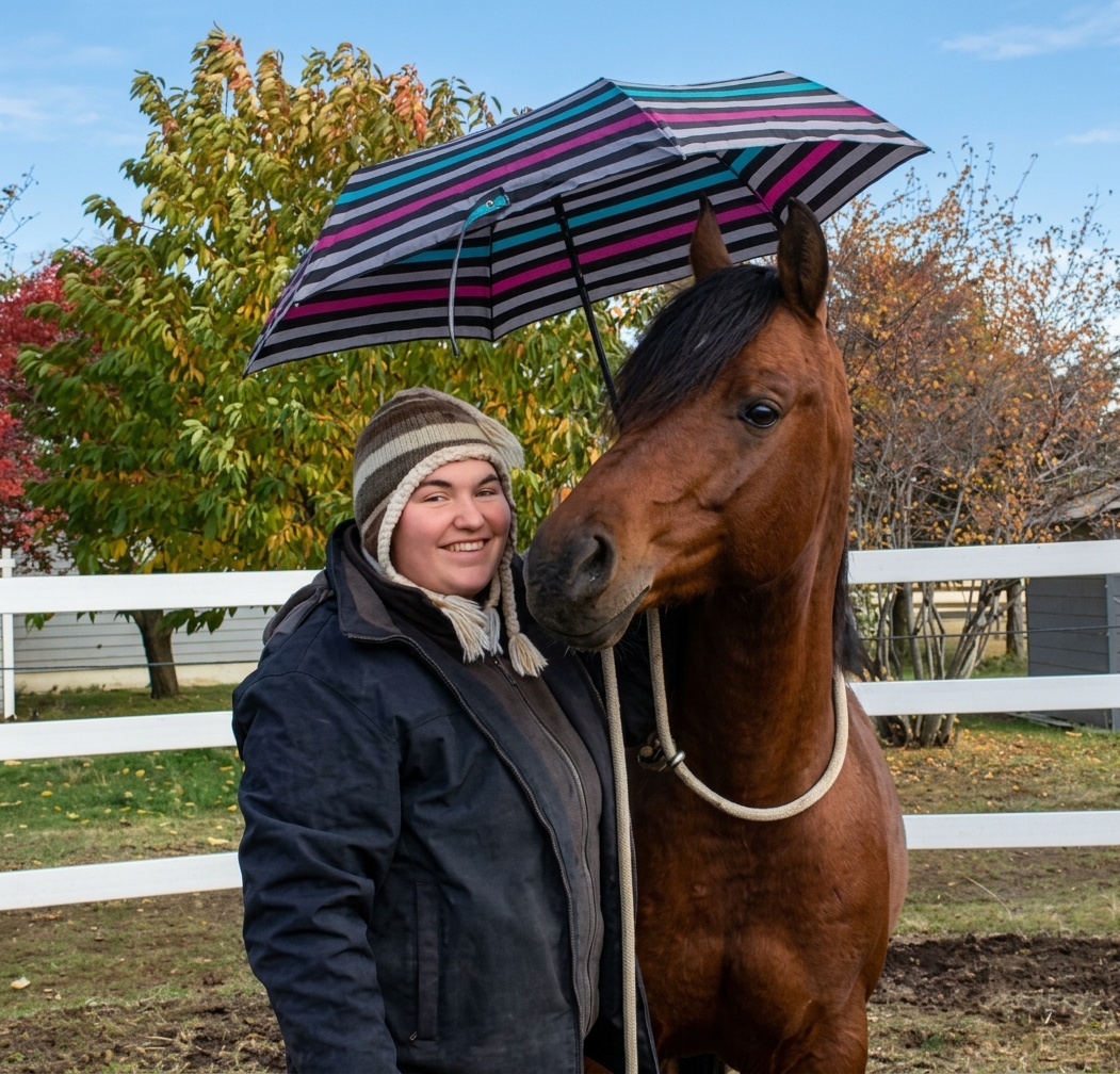 Bridgette and Eddie beneath an umbrella