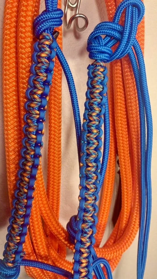 Orange and blue rope tack set with decorative braiding